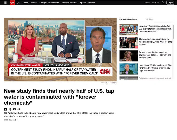 CNN news broadcast with three anchors discussing water contamination, displayed on a computer screen.