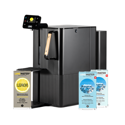 Black water dispenser with Lang Water lemon and Alpine drink packages on a white background